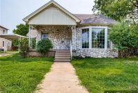 Elmwood’s Timeless Treasure: A 3-Bedroom Cottage on an Expansive Lot, Brimming with History