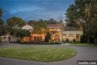 Santa Barbara Serenity: A Preston Hollow Estate Defined by Lush Courtyards