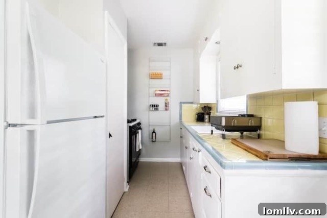 Side view of the adorable duplex, highlighting its clean lines and inviting outdoor space.