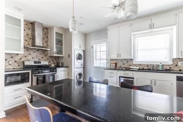 Refinished hardwood floors and crisp white walls in one of the renovated duplex units, showcasing modern updates.