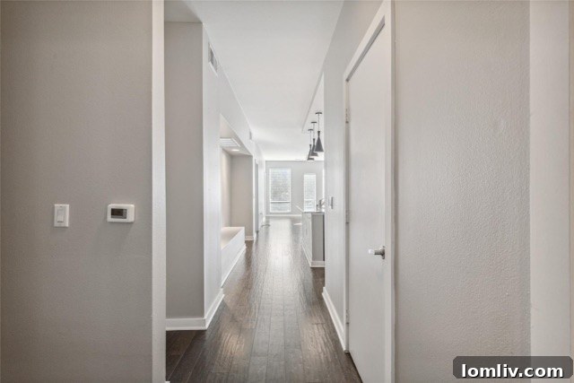 $375K Dilemma Oak Lawn Townhome or McKinney Condo 6 A well-lit, open-concept living area in the Oak Lawn condo, emphasizing modern updates and functional design.