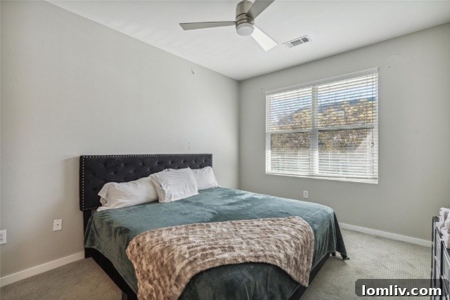$375K Dilemma Oak Lawn Townhome or McKinney Condo 10 A comfortable bedroom in the Oak Lawn condo, designed for relaxation with a focus on functional elegance.