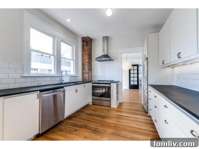 Renovated kitchen area in a historic condo with modern appliances