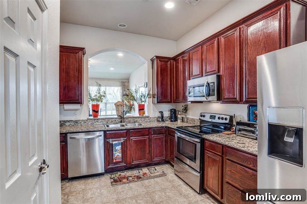 Spacious living room with large windows overlooking a golf course, featuring modern furniture and luxury plank flooring