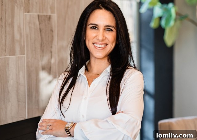 Roxy Diamond, a Dallas Realtor with a legal background, standing confidently.