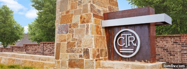 Aerial view of a new master-planned community with homes and green spaces.