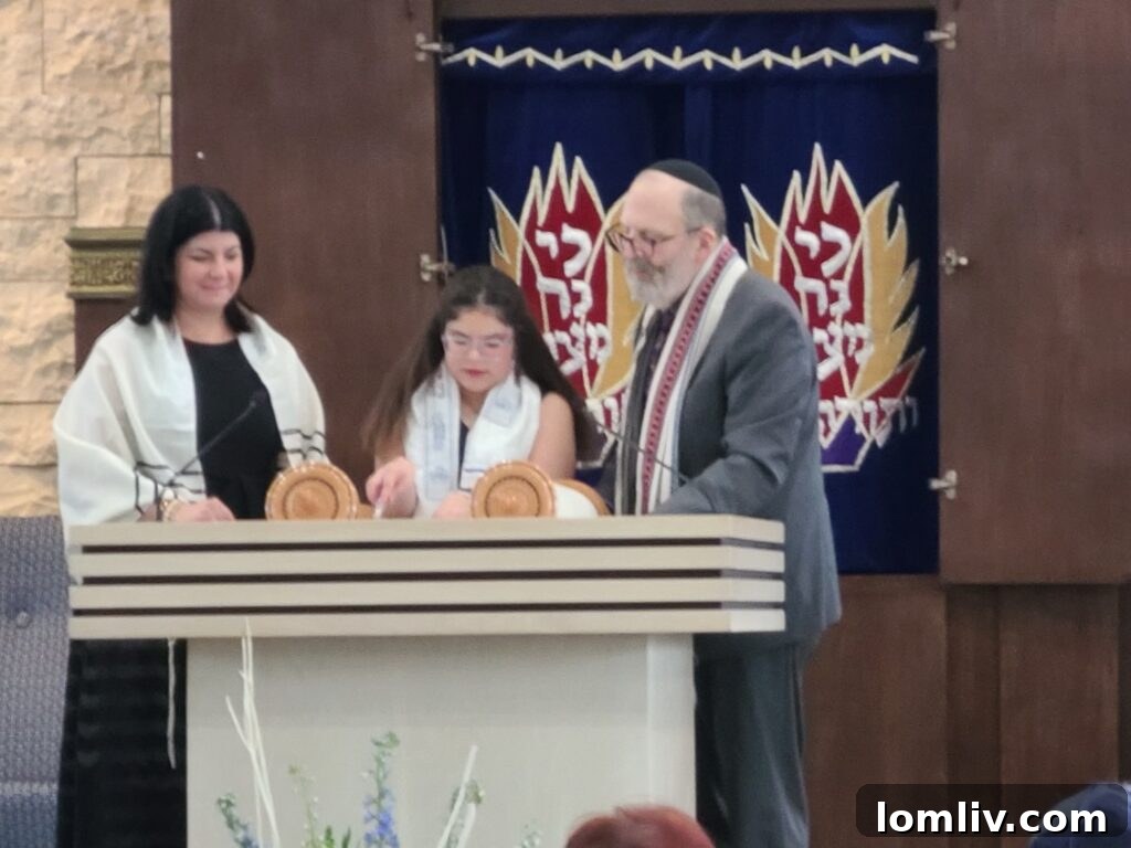 Lilia Mydlarz, flanked by her mother, Laura Mydlarz, and Rabbi Scott Sperling at her bat mitzvah.
