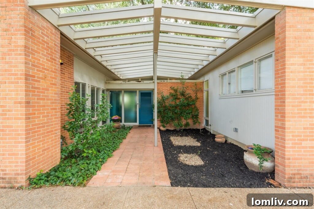 Inviting Terracotta Walkway to a Midcentury Modern Entrance