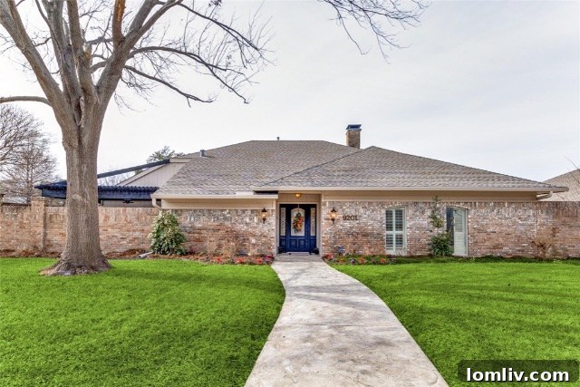 Exterior view of a stunning home in Lake Highlands, Dallas, showcasing a well-maintained facade and inviting curb appeal.