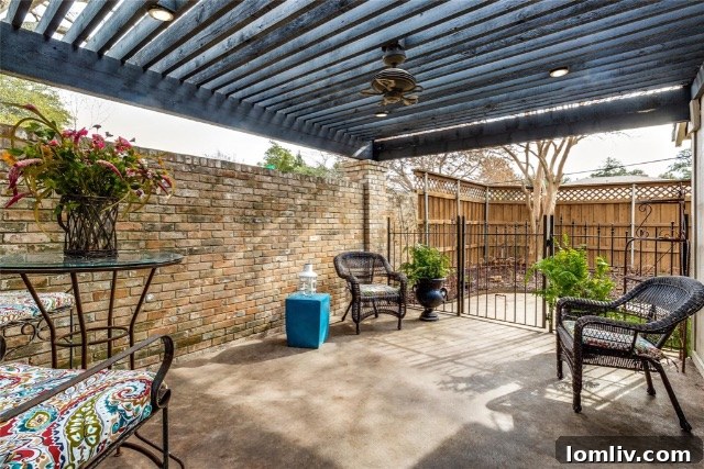 Overhead shot of the backyard, showcasing the complete outdoor living experience with pool, patios, and green space.