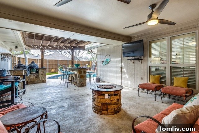 Another view of the expansive backyard oasis, highlighting the pool, artificial grass, and various entertainment zones.