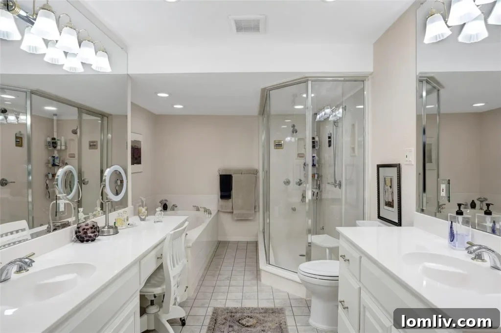 Dual vanities in the primary bathroom, offering ample space and contemporary design.