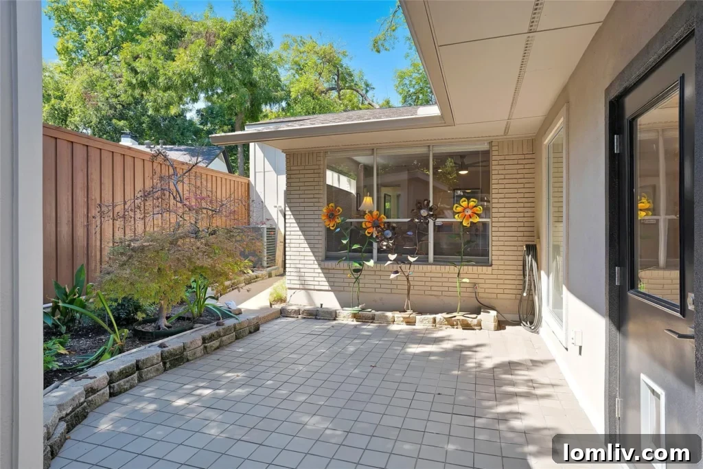 The unique backyard area, showcasing artistic sculptures and thoughtful landscaping.