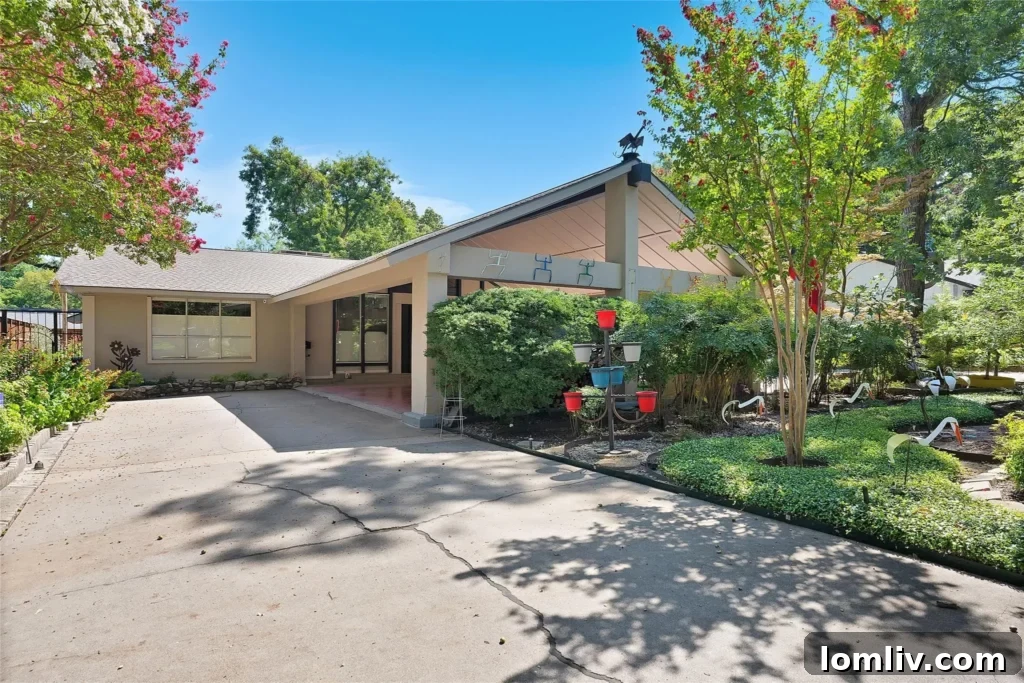 The newly renovated facade of 1652 Sylvan Avenue, featuring large rectangular windows that replaced original arched designs.