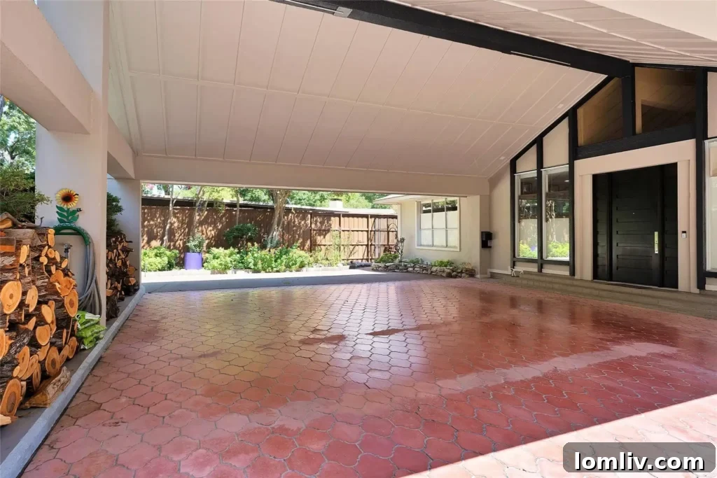 An interior shot revealing the open floor plan and abundant natural light, characteristic of midcentury modern design.