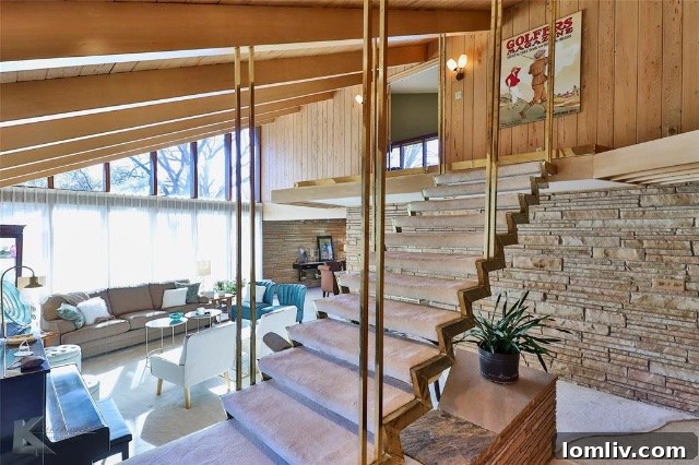 The expansive living area of the Cree House, featuring iconic mid-century furniture and a view towards the conversation pit.