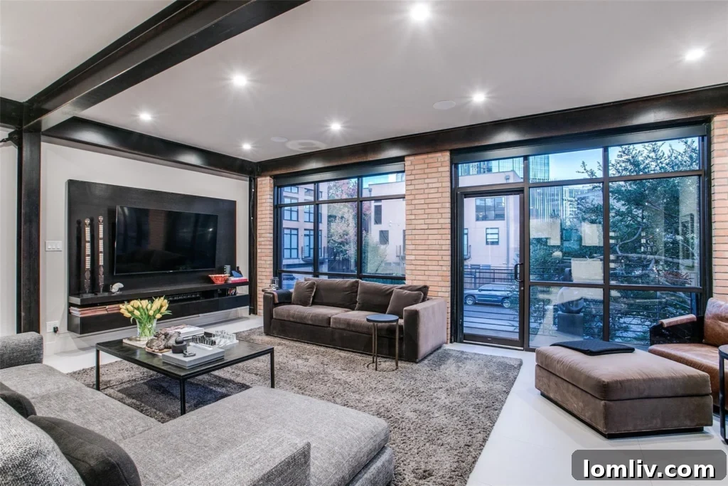 Elegant kitchen featuring black honed granite countertops and high-end Sub-Zero appliances in a Dallas luxury home