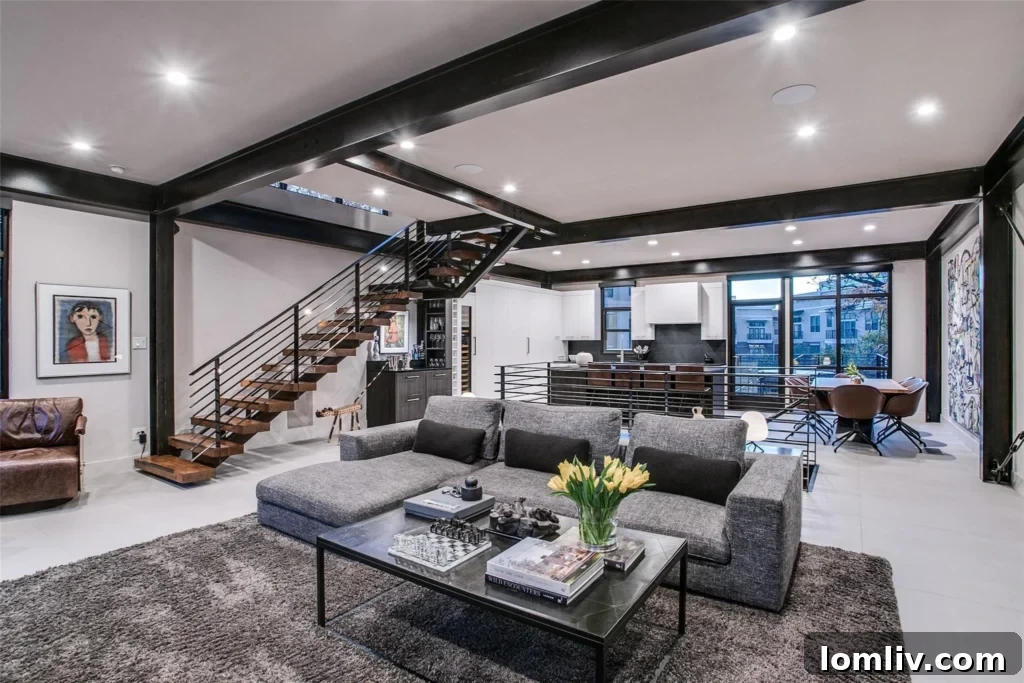 Spacious open-concept living area with modern furnishings and abundant natural light, perfect for entertaining