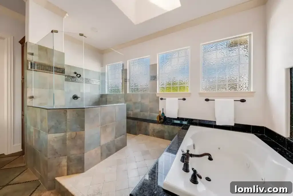 Discover Your Modern Townhome Sanctuary Near Highland Park 9 Elegant Primary Bedroom with Private Balcony and Fireplace