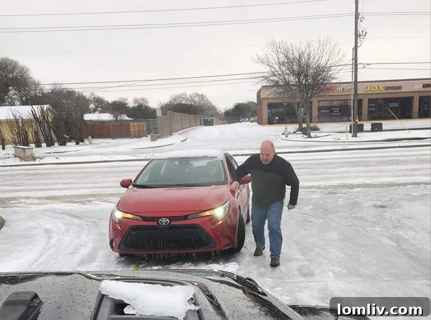 Patrick Abell, a Dallas Realtor, uses his Jeep Wrangler to assist stranded motorists during severe icy weather conditions.