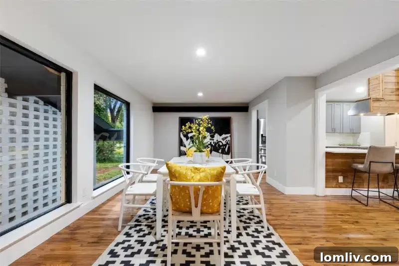 Before and after comparison: a dated bathroom with a single vanity and old tiles replaced with a luxurious, modern ensuite featuring double vanities and custom tile work.