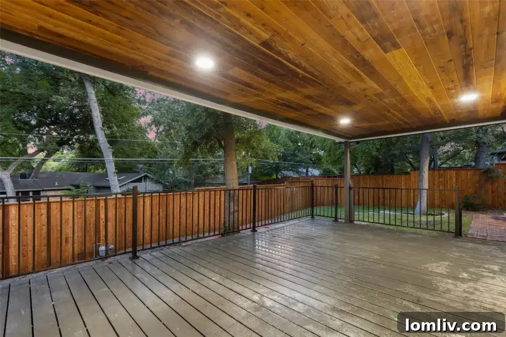 Modern kitchen with light wood custom cabinets, white quartz countertops, stainless steel appliances, and a Viking gas range.
