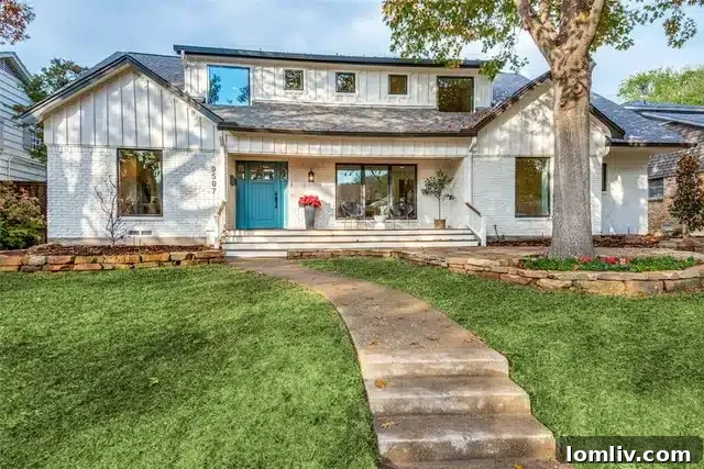 Renovated exterior of 9507 Covemeadow Drive with fresh white paint and new landscaping