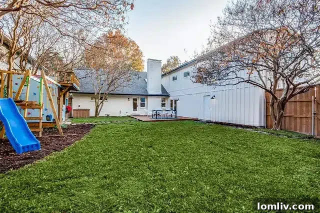 Expansive deck and green backyard of 9507 Covemeadow Drive