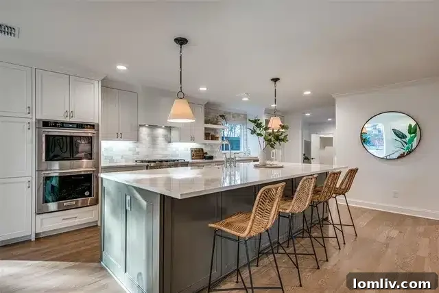 Open-concept kitchen and living area at 9507 Covemeadow Drive with large island