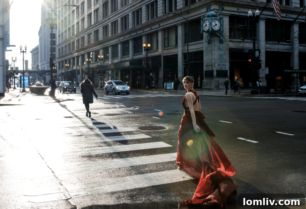 Lori Sapio expertly capturing a subject's portrait with her professional camera and lighting