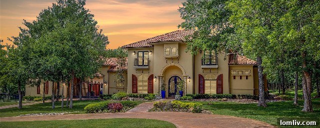 Beautiful Hacienda-style home in Oak View Estates in Hudson Oaks, featuring classic Spanish Colonial architecture with a grand entrance.