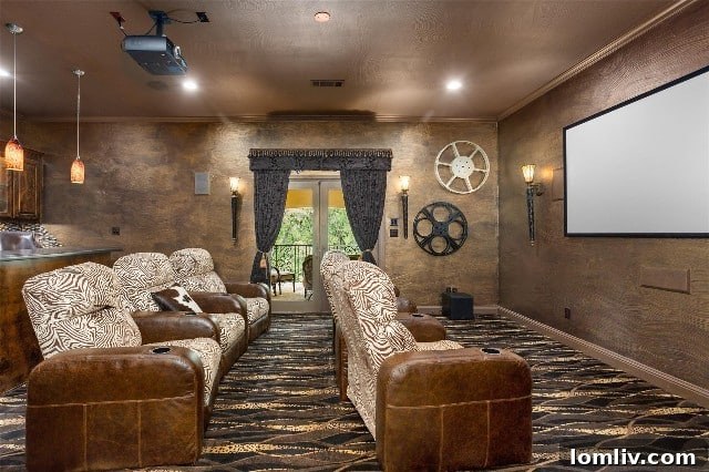 Comfortable chairs, a dark ambiance, and a wet bar in a luxurious media room, perfect for entertaining.