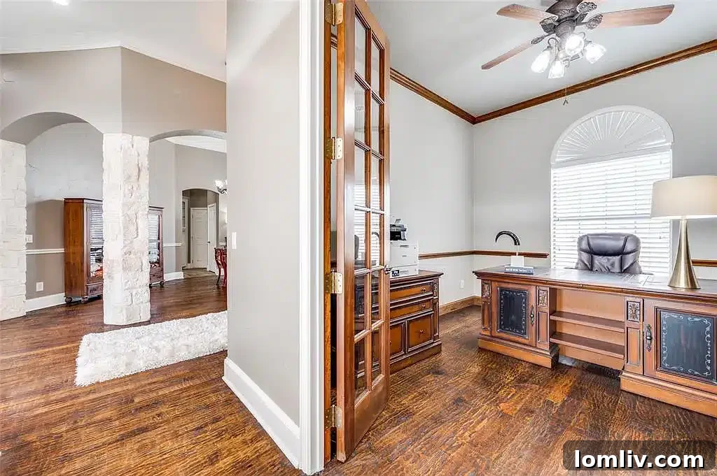 Modern kitchen with large island and stainless steel appliances.