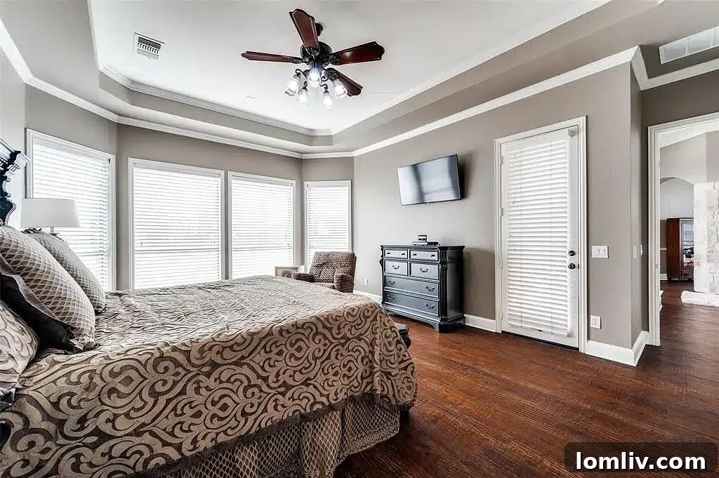 Luxurious master suite with ample space and comfortable furnishings.