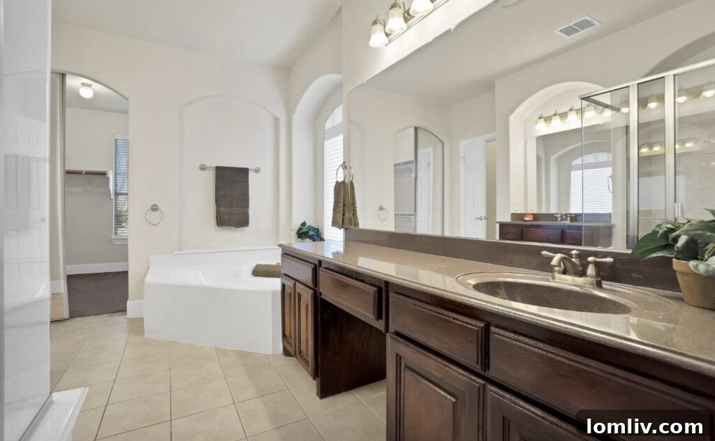 Comfortable bedroom with natural light and a view of the backyard.