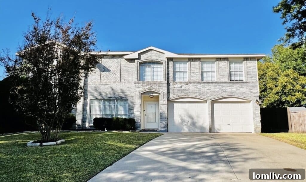 Cozy living area in a McKinney home, freshly painted and carpeted.