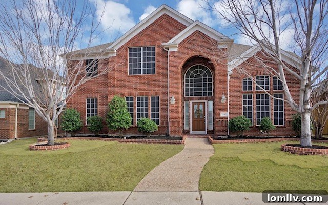 Modern suburban home exterior in Frisco, Texas, with well-maintained landscaping.