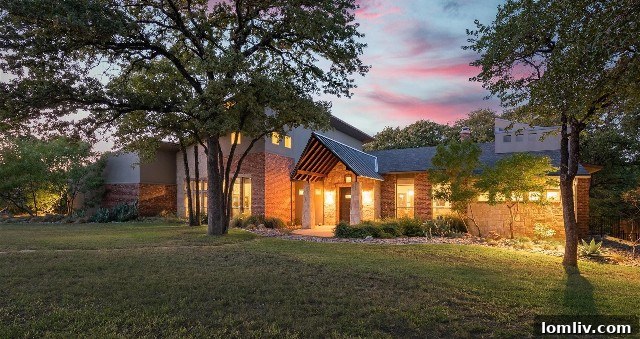Expansive Keller home on 1.76 acres featuring Texas Hill Country architectural style with stone, brick, and mature trees
