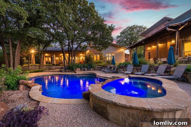 A unique home and guest house in Keller, Texas, built with Austin Stone, brick, and stucco, seemingly nestled around mature trees