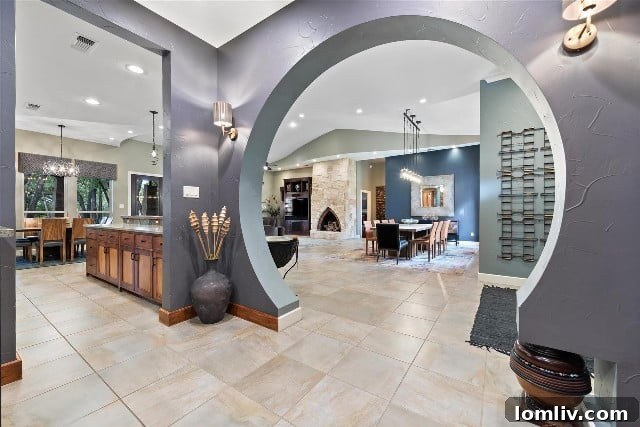 Captivating circular archway entrance inside a luxury Keller home, showcasing unique architectural details