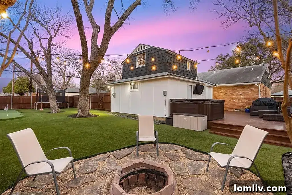 View of the hot tub and fire pit area in the backyard.