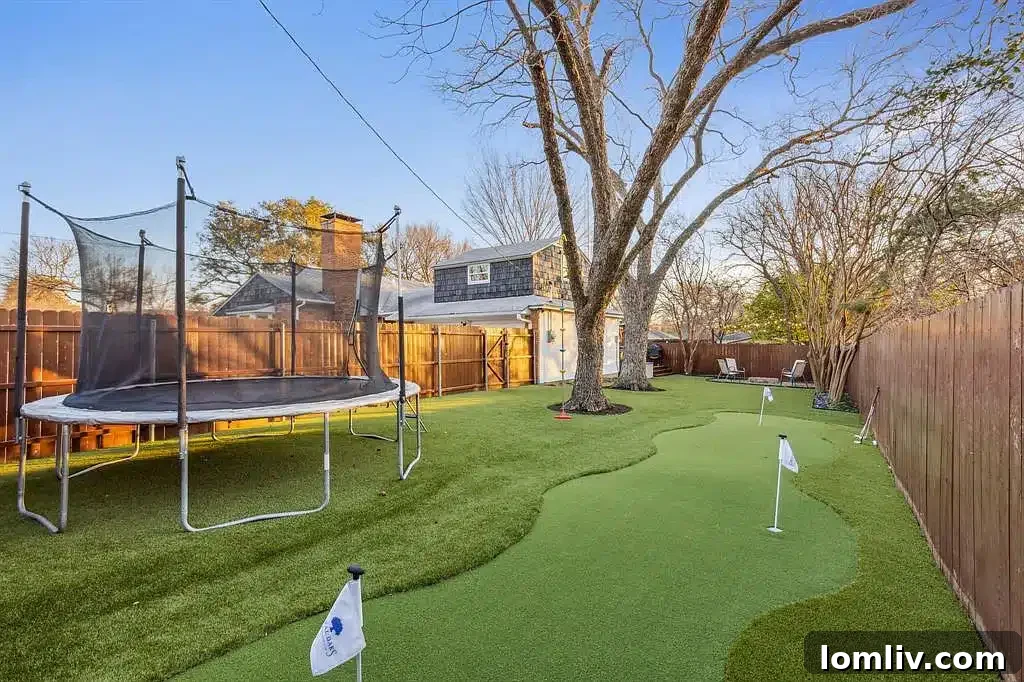 Close-up of the putting green in the low-maintenance turfed backyard.