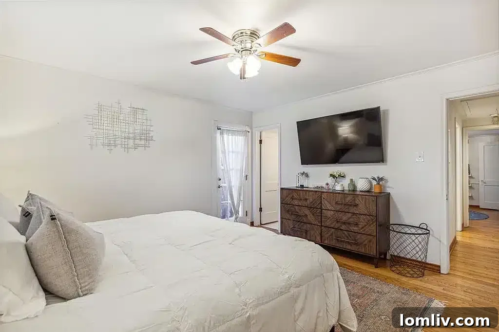 Spacious primary bedroom with ample natural light.