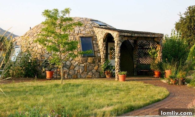 A modern residential Monolithic Dome situated in Brigham City, Box Elder County, Utah, showcasing a blend of contemporary design and durable construction.