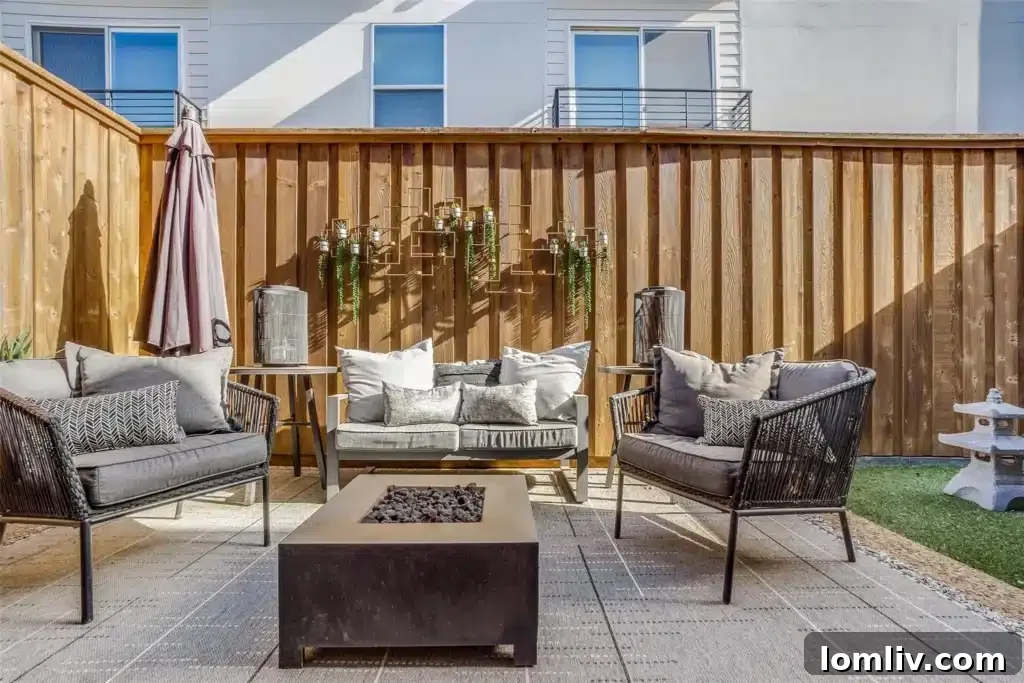 Oaklawn's Oglesby Gem: A Tranquil Escape 13 Low-maintenance backyard with space for entertaining and relaxation.