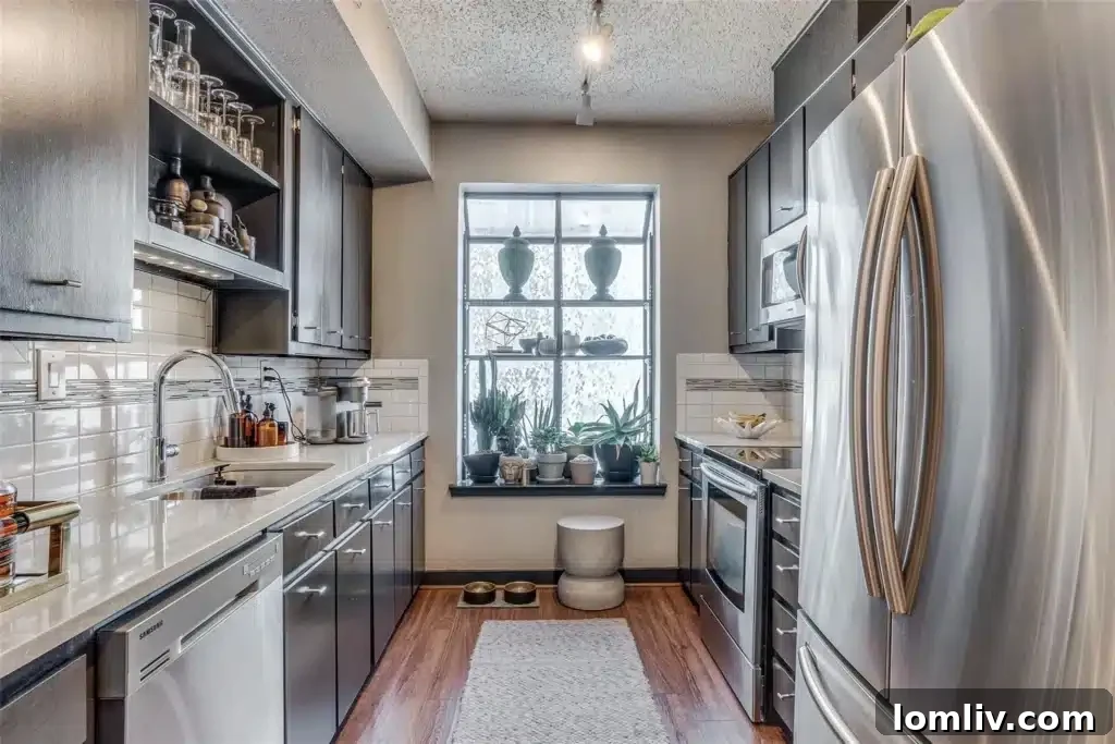 Oaklawn's Oglesby Gem: A Tranquil Escape 10 Modern kitchen with stainless steel appliances and a stylish backsplash.