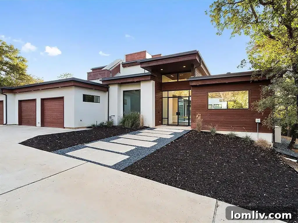 Striking modern home at 2700 N Kimball Avenue, Southlake, showcasing its architectural design against a backdrop of natural beauty.