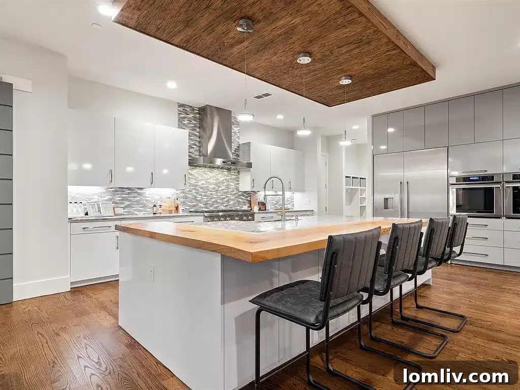 Sleek modern kitchen with minimalist design and high-end integrated appliances at 2700 N Kimball Avenue.