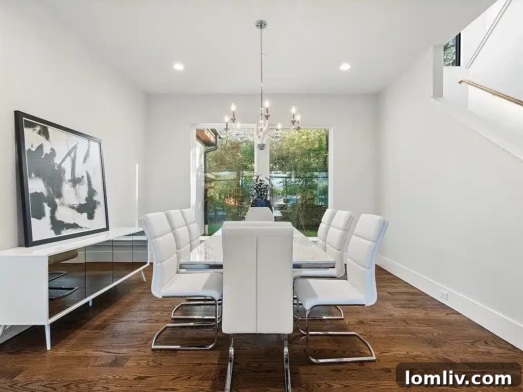 Luxurious master bedroom with private access to the outdoor deck and breathtaking natural views.