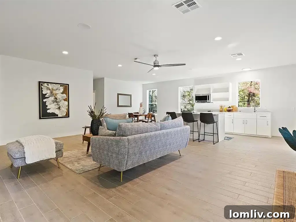 Aerial shot showcasing the modern home, guest house, and vast natural surroundings with Lake Grapevine in the distance.